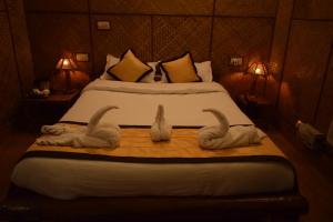 Ένα ή περισσότερα κρεβάτια σε δωμάτιο στο Blue Bird Resort