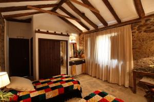 Łóżko lub łóżka w pokoju w obiekcie El Añadío