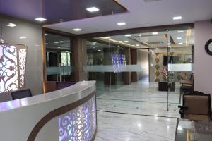 a lobby with a reception desk in a building at Hotel Ajmer Tower in Ajmer