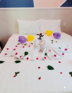 Postel nebo postele na pokoji v ubytování Q Songchi Hotel