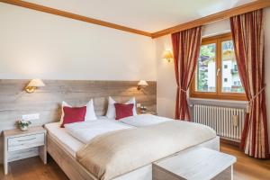Postel nebo postele na pokoji v ubytování Hotel Erna