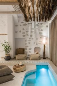 a villa with a swimming pool in a room at Aphrodite Luxury apartment in Astypalaia