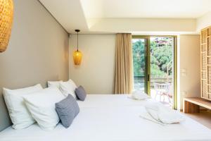 Postel nebo postele na pokoji v ubytování Physis Villas Chania