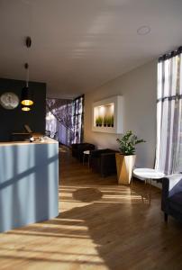 a living room with a couch and a table at Hotell Tammsaare in Pärnu