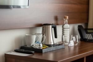Príslušenstvo na prípravu kávy alebo čaju v ubytovaní Bohemia Inn Hotel