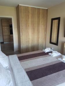 Łóżko lub łóżka w pokoju w obiekcie Apartament Bałtyk Polanki Park, basen, sauna, fitness, sala zabaw dla dzieci