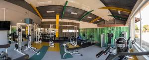 a gym with lots of exercise equipment in it at Hotel & Distillery Monogram in Mišići