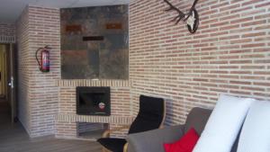 Гостиная зона в Apartamentos "Casa Rural de Aldea"