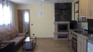 Кухня или мини-кухня в Apartamentos "Casa Rural de Aldea"
