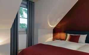 Postel nebo postele na pokoji v ubytování Patentkrug Design Hotel