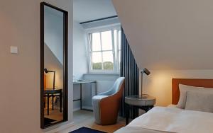 Postel nebo postele na pokoji v ubytování Patentkrug Design Hotel