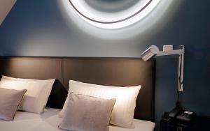 Postel nebo postele na pokoji v ubytování Patentkrug Design Hotel