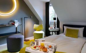 Postel nebo postele na pokoji v ubytování Patentkrug Design Hotel
