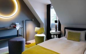 Postel nebo postele na pokoji v ubytování Patentkrug Design Hotel