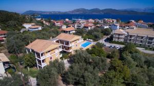 an aerial view of a town with houses and the water at Summertime Inn in Nikiana