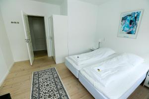 Postel nebo postele na pokoji v ubytování Hotel 9 små hjem