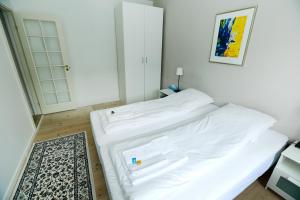 Postel nebo postele na pokoji v ubytování Hotel 9 små hjem
