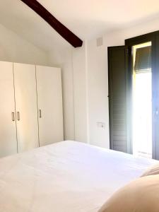 מיטה או מיטות בחדר ב-Mon Residence Sant Jeroni