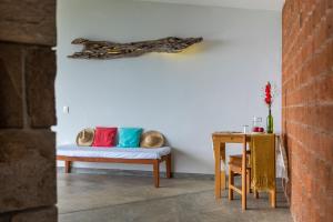 
a living room with a couch and a table at Cocolia Hotel in Mazunte
