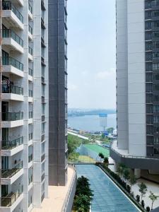 a view of the ocean from the balcony of a building at R&F Princess Cove @ R&F Mall in Johor Bahru