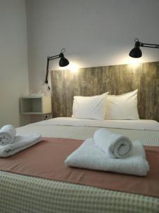 A bed or beds in a room at Aitherial Summer House