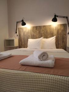 A bed or beds in a room at Aitherial Summer House