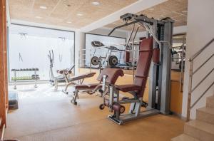 a gym with exercise equipment and an rv in the background at AZ Hôtels Zeralda in Zeralda