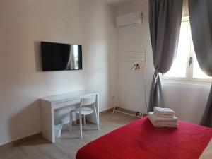 TV a/nebo společenská místnost v ubytování B&B Pompeii Rooms + 20 fotografií