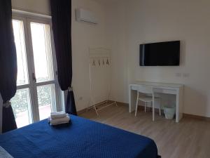 TV a/nebo společenská místnost v ubytování B&B Pompeii Rooms