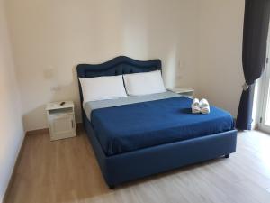 Postel nebo postele na pokoji v ubytování B&B Pompeii Rooms