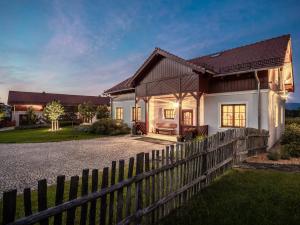 a house with a fence in front of it at Willa Wzgórze Poręba in Długopole-Zdrój