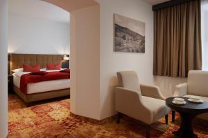 Posteľ alebo postele v izbe v ubytovaní Hotel Singer