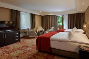 Posteľ alebo postele v izbe v ubytovaní Hotel Singer + 37 fotografií