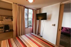 TV a/nebo společenská místnost v ubytování Dpto 1D 1B, Metro Bellas Artes, equipado full con WiFi