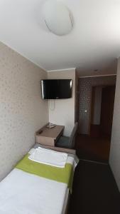 Postel nebo postele na pokoji v ubytování Restauracja i Noclegi Pod Kasztanami