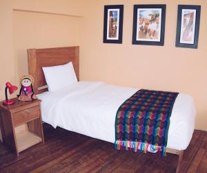 Llit o llits en una habitació de Eco Aventura Hostel Cusco