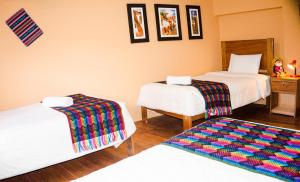 Llit o llits en una habitació de Eco Aventura Hostel Cusco