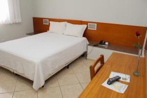 Postel nebo postele na pokoji v ubytování Ônix Hotel