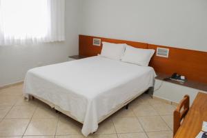 Postel nebo postele na pokoji v ubytování Ônix Hotel