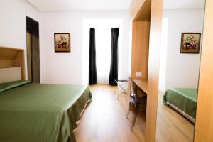 Posteľ alebo postele v izbe v ubytovaní Nerello Suites and Rooms
