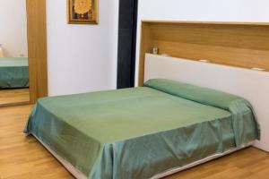 Posteľ alebo postele v izbe v ubytovaní Nerello Suites and Rooms