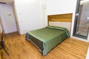Posteľ alebo postele v izbe v ubytovaní Nerello Suites and Rooms