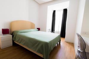 Posteľ alebo postele v izbe v ubytovaní Nerello Suites and Rooms