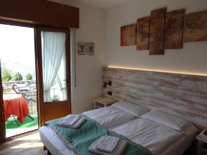 Postel nebo postele na pokoji v ubytování B&B Casa Gabriele + 37 fotografií