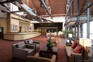 a lobby with couches and chairs and a waiting room at Airtel Plaza Hotel in Van Nuys