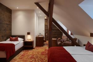 Posteľ alebo postele v izbe v ubytovaní Hotel Singer