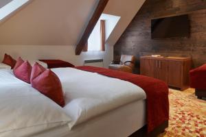 Posteľ alebo postele v izbe v ubytovaní Hotel Singer