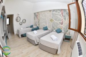 Posteľ alebo postele v izbe v ubytovaní La Posidonia Case Vacanza