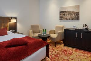 Posteľ alebo postele v izbe v ubytovaní Hotel Singer