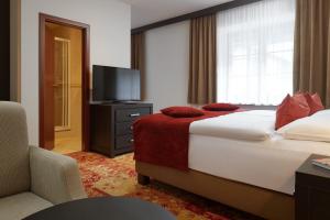 Posteľ alebo postele v izbe v ubytovaní Hotel Singer